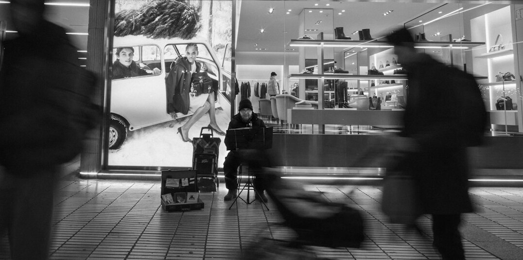 store detective watching shoppers