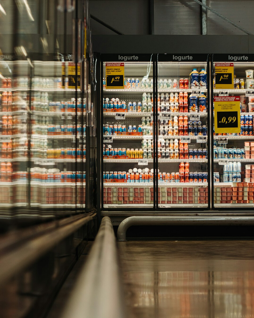 store detective chasing thief in supermarket aisle